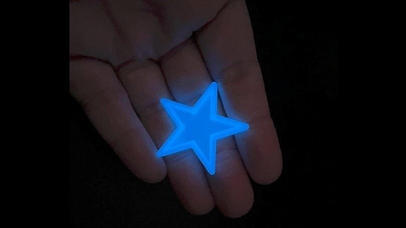 A brilliant blue glow-in-the-dark star
