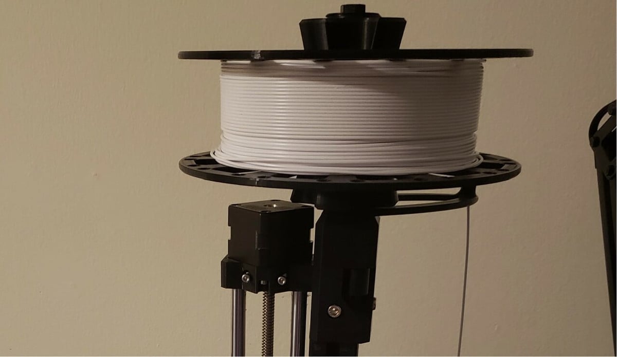 This top-mounted spool holder uses 2 3D printed parts and a handful of screws and bolts