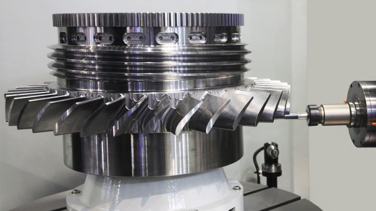 product-1-1 A CNC Mill cutting a complex part out of metal