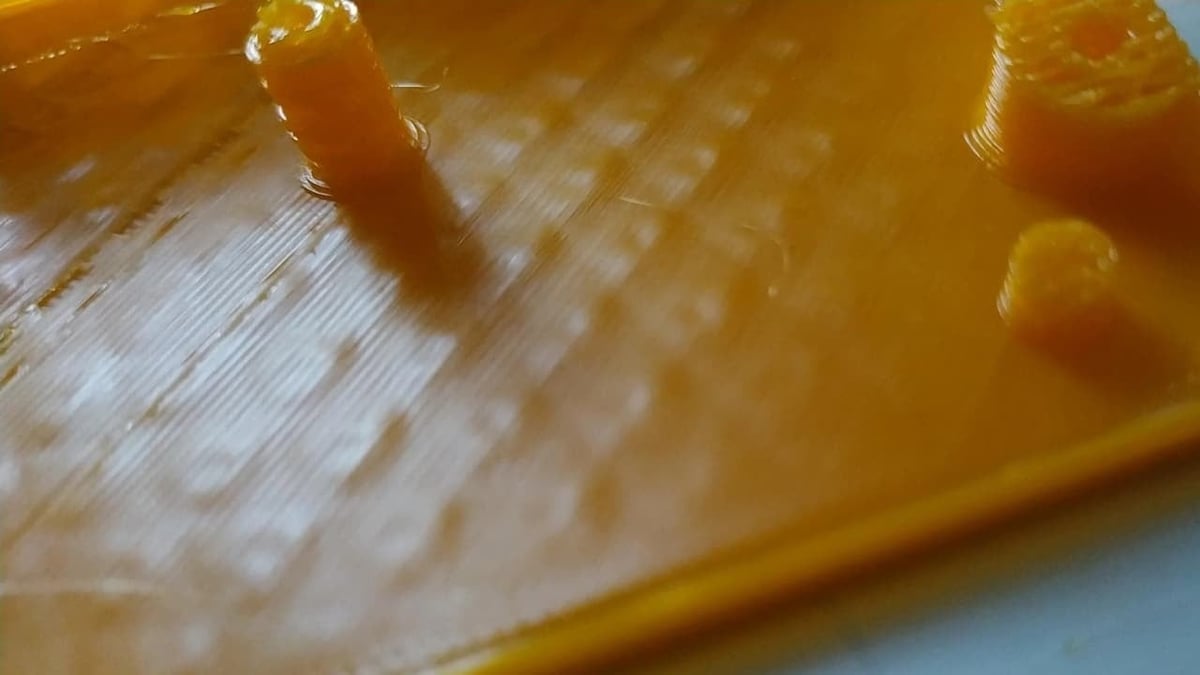 When a top layer experiments pillowing, the infill pattern can be visible through it