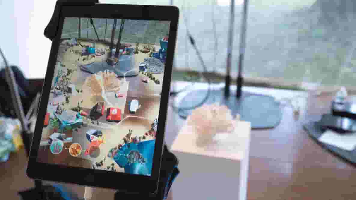 Featured image of White Noise AR Art Shows Us We’re All Terrible People