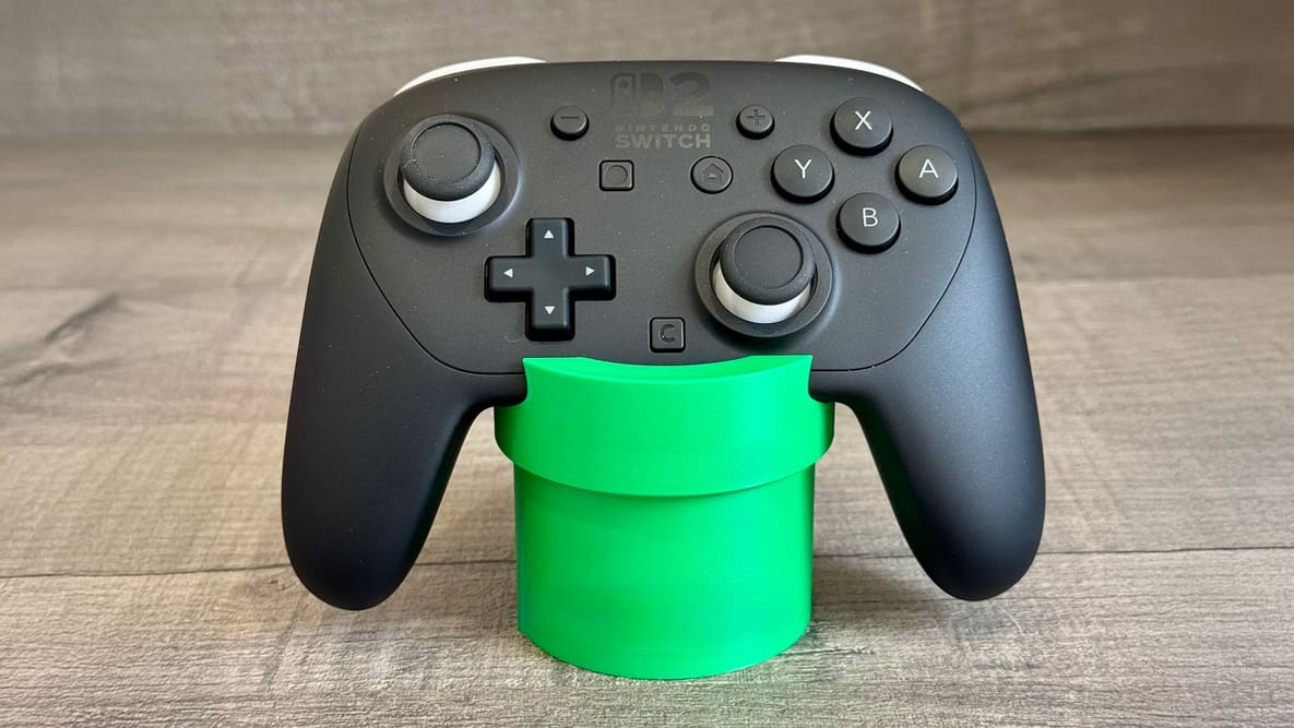 Featured image of Stow Your Switch 2 Pro Controller on This 3D Printed Warp Pipe Stand