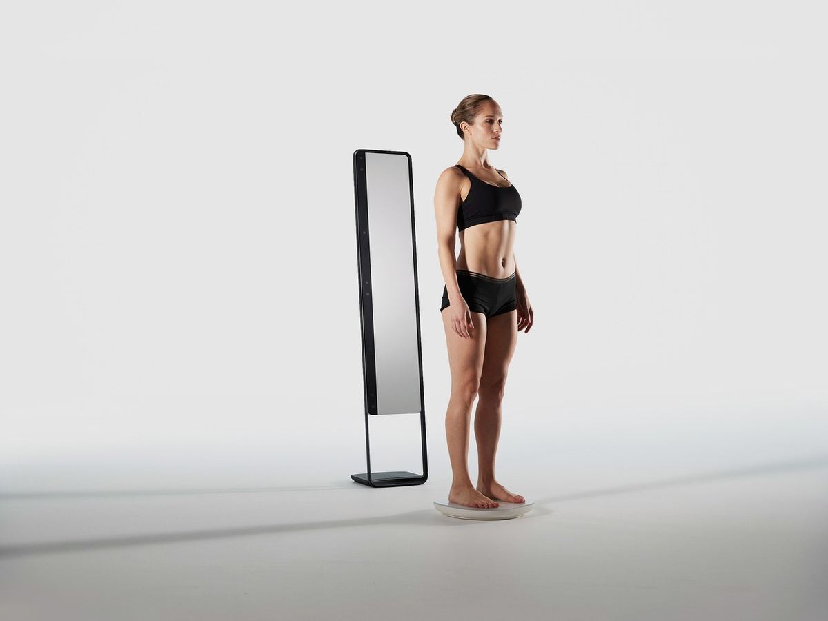 Person demonstrating correct A-pose position for accurate 3D body scanning at home