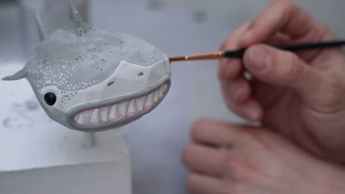 Using acrylic paint and a paintbrush
