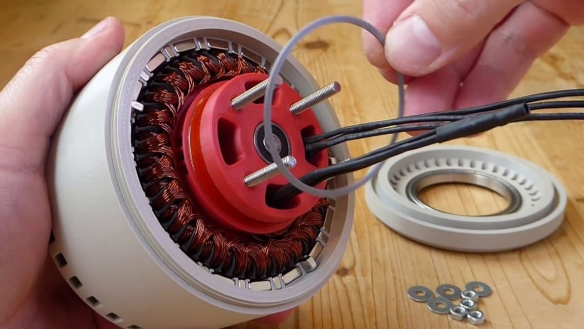 A 3D printed motor undergoing assembly.
