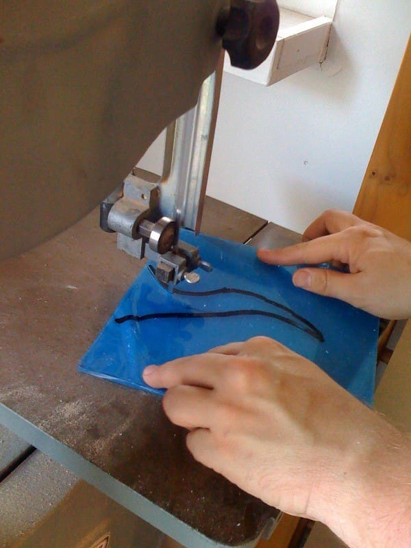 Cutting curves into Plexiglass using a bandsaw is easy and quick as shown here.