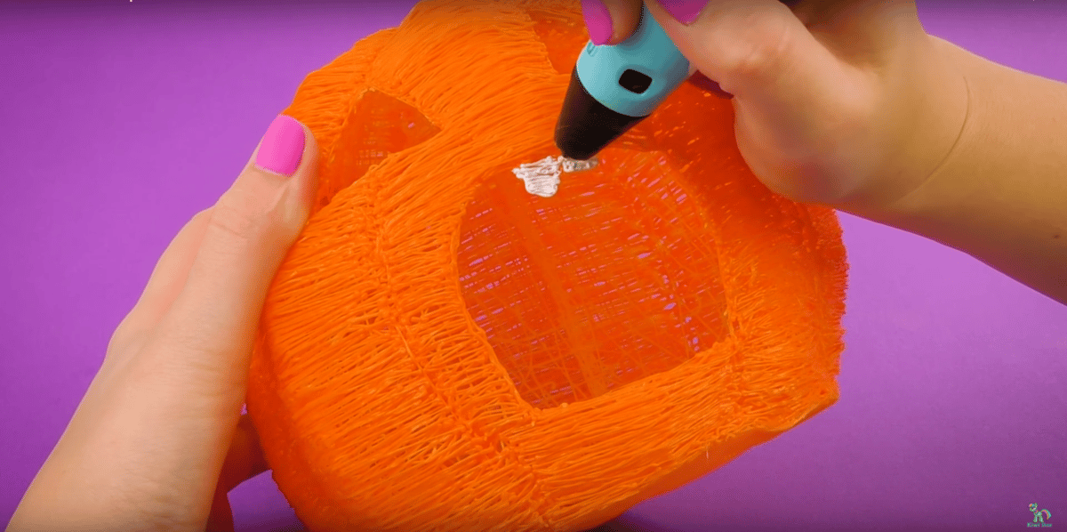 Adding details to a pumpkin-themed hamster house