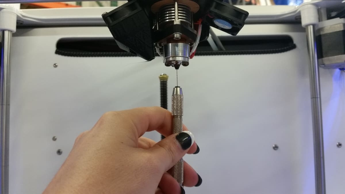 A nozzle-cleaning needle is very effective