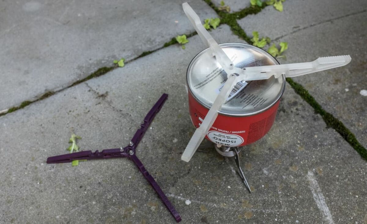 This stove stand fits on most outdoor propane tanks