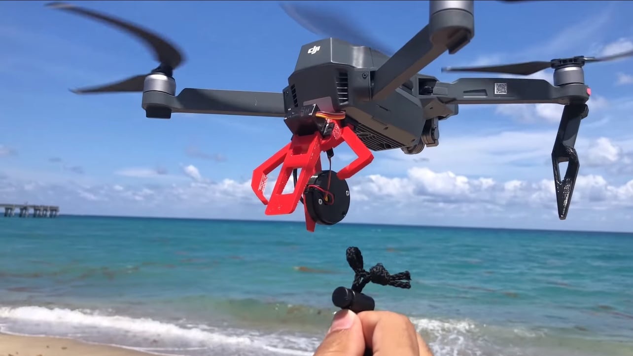 Drone with top camera and claw